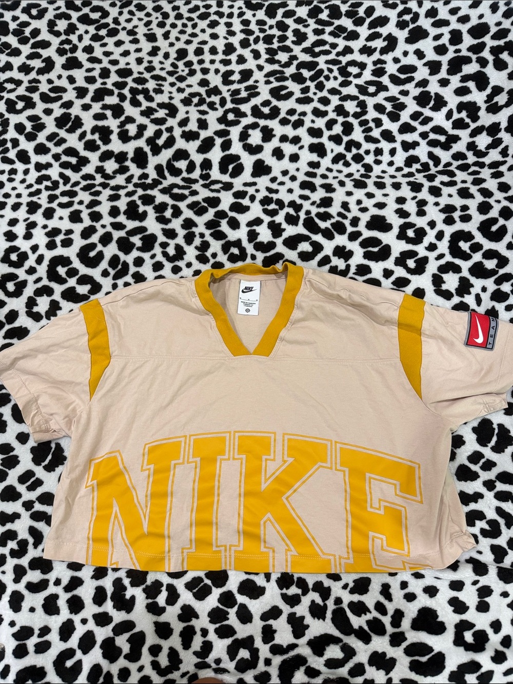 Nike Beige Crop Tee with Yellow NIKE Block Lettering